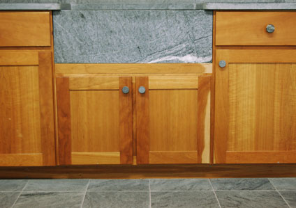 soapstone countertop, sink, and floor tiles